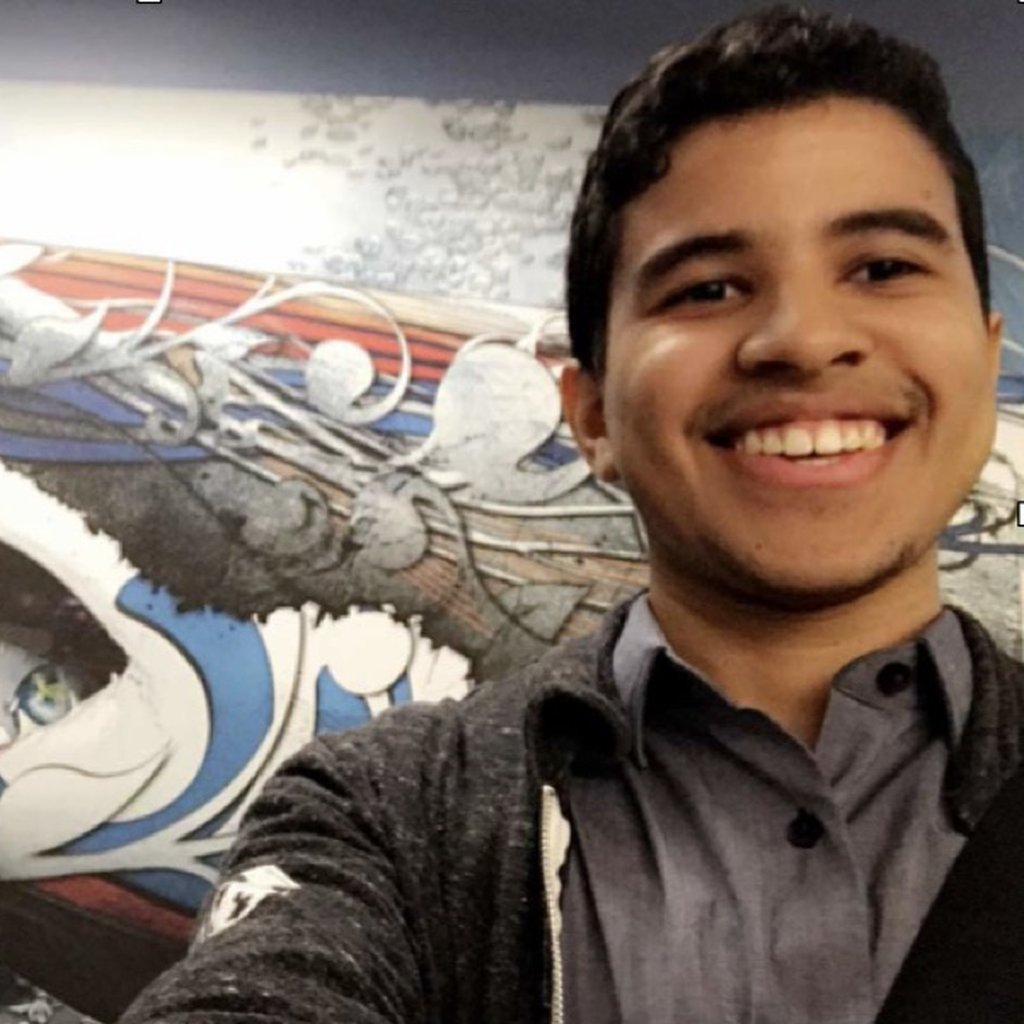 Brandon next to Discovery shark mural