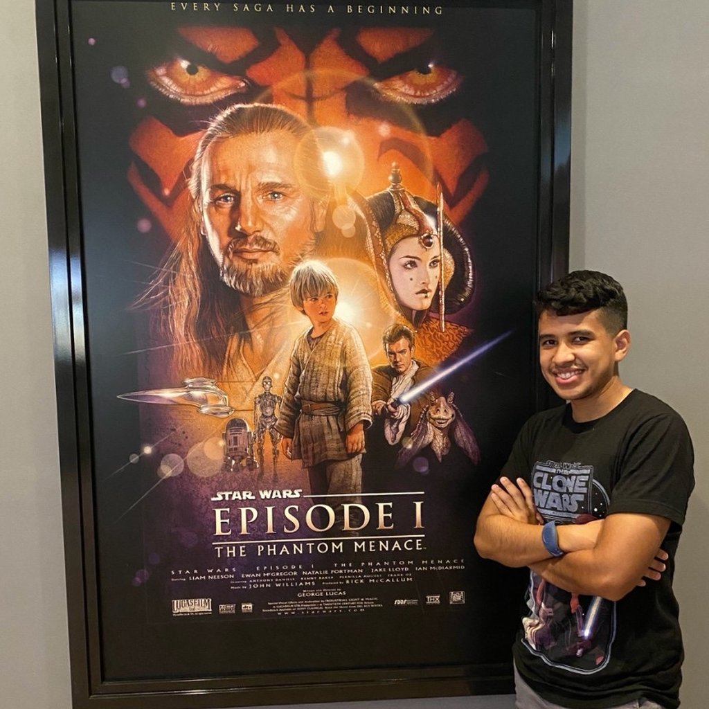 Brandon next to a Star Wars Episode I poster